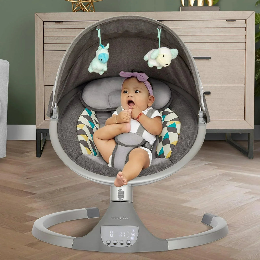 Nouveauté 2026 – Balancelle pour bébé Dream On Me Zazu . Balancelle pour nourrisson. 5 vitesses de balancement. Deux jouets intégrés. Connectivité Bluetooth et télécommande. Gris et bleu